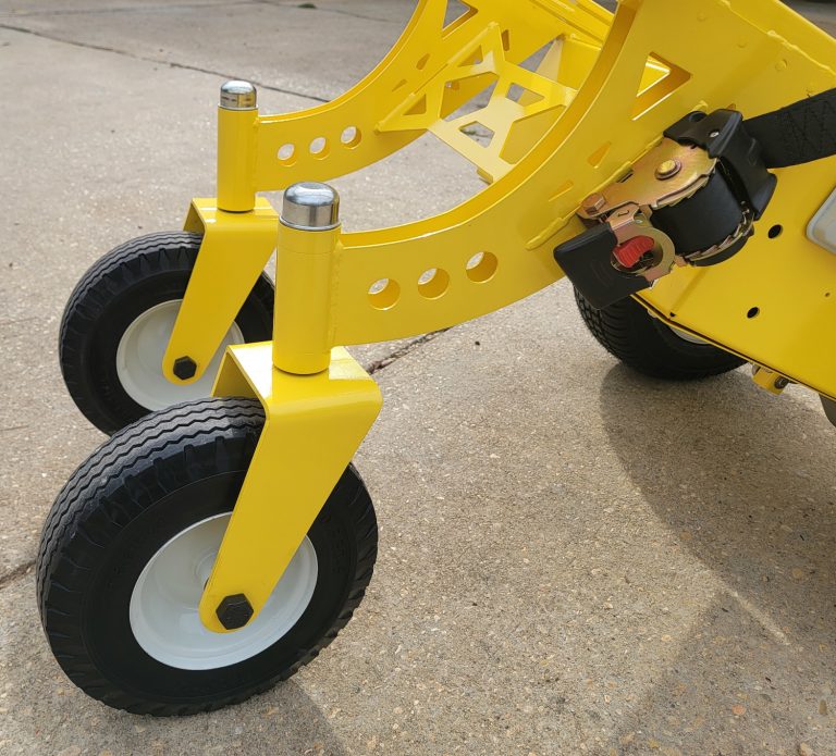 Swivel wheels on the rear of a Power Plus direct drive dolly